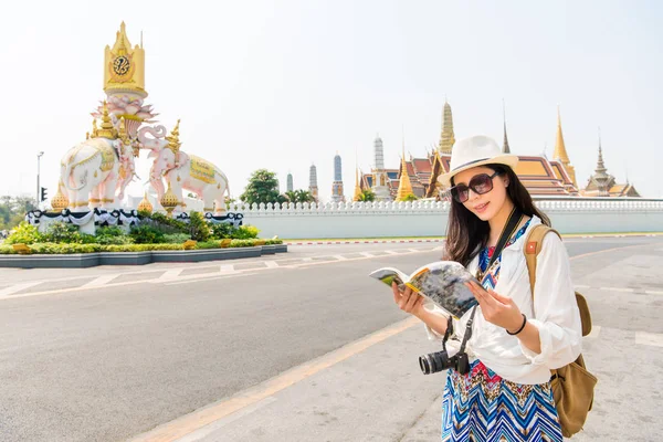 a female tourist near a temple in Thailand